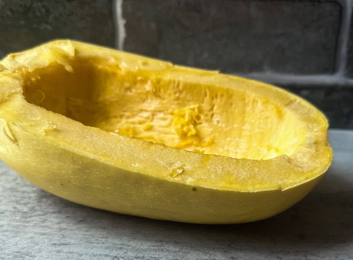 A photo of a spaghetti squash half before being cooked.