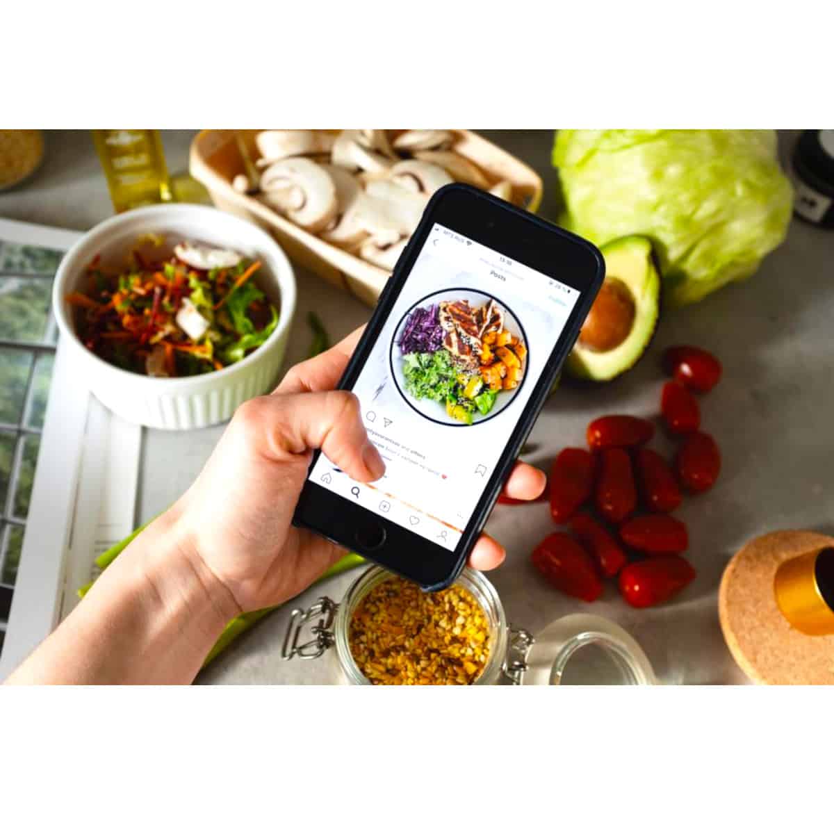 a picture of a meal and a person holding a cell phone researching the meal in a healthy online app