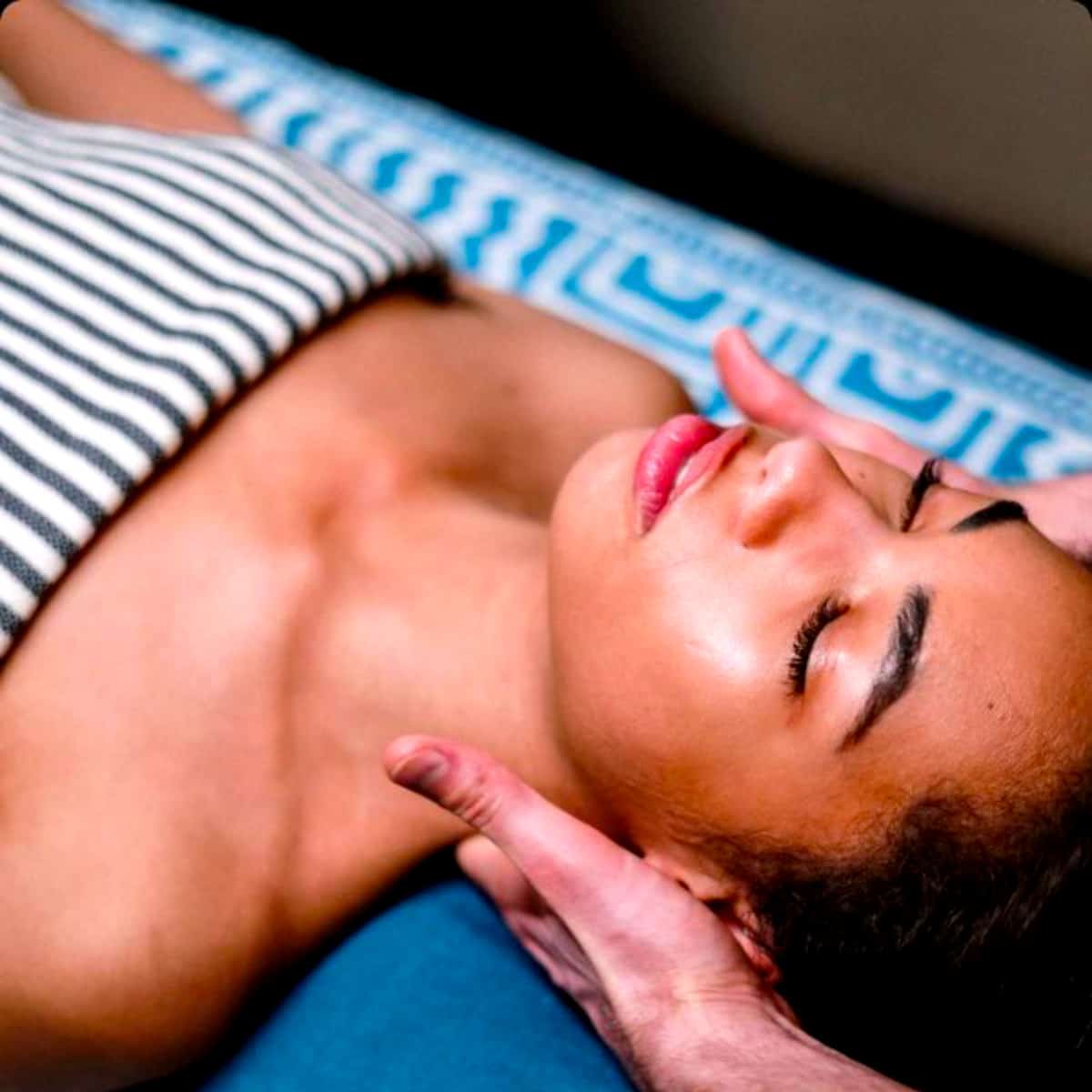 a woman receiving a massage lying down