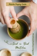 a light grey background photo with light skinned hands holding a tan ceramic matcha bowl and a light tan matcha whisk with several tines about to whisk a dark green matcha tea. decoratively placed at the bottom are two white and tan smaller ceramic bowls. in dark green writing on a tan banner at the top reads Matcha buying guide in cursive font. below the tea picture reads Good vs Bad Matcha in bold cursive and below that in non bold type says and how to tell the difference! on the left along the side turned reads mindfullyhealthyliving.com