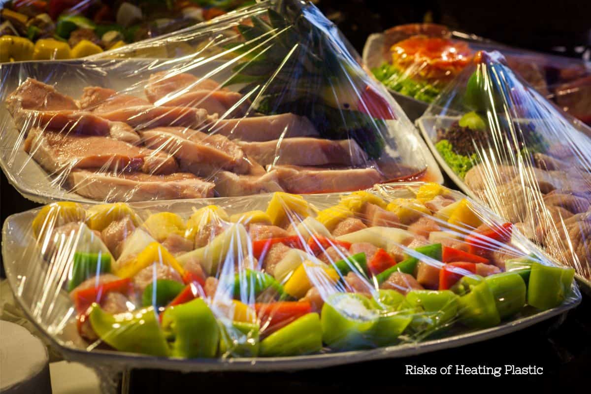 Prepared meals wrapped in plastic film, illustrating the risks of heating plastic in food preparation