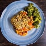 A complete Keto Chicken Parmesan Casserole on a blue dish, served.