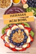 A Pinterest-ready image of a Hawaiian açaí bowl, beautifully garnished with slices of strawberries, bananas, kiwi, and blueberries, with a headline reading 'Hawaiian Acai Bowl' from mindfullyhealthyliving.com.