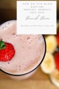 A promotional image for a blog post featuring a must-try 'Beach Bum' smoothie dupe from Tropical Smoothie Cafe, with a glass of pink smoothie garnished with a strawberry.