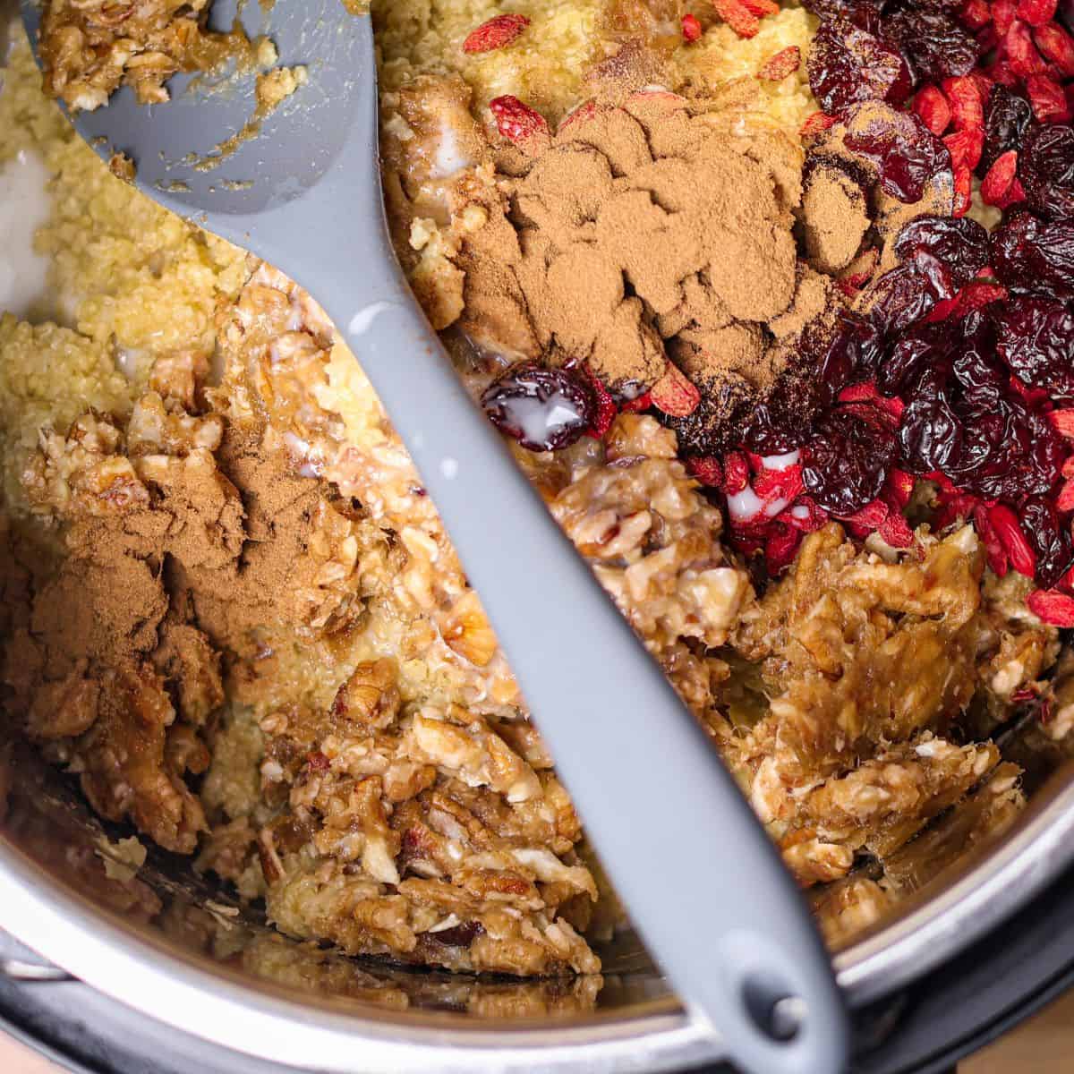 A close-up of an Instant Pot filled with cooked millet topped with a mound of cinnamon, bright red goji berries, dark dried cherries, and a mixing spatula.