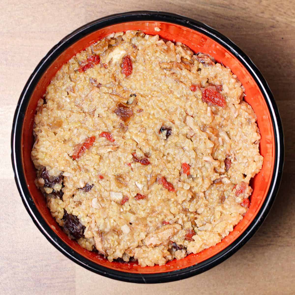 The image served the millet porridge into a bowl.