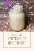 A mason jar filled with a creamy health nut smoothie with a purple-striped straw. Text overlay reads 'how to make Nekter’s PB Health Nut' with the website 'mindfullyhealthyliving.com'.