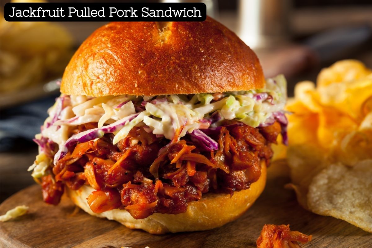 A large brioche sandwich bun is stuffed with barbecue pulled jackfruit and coleslaw.