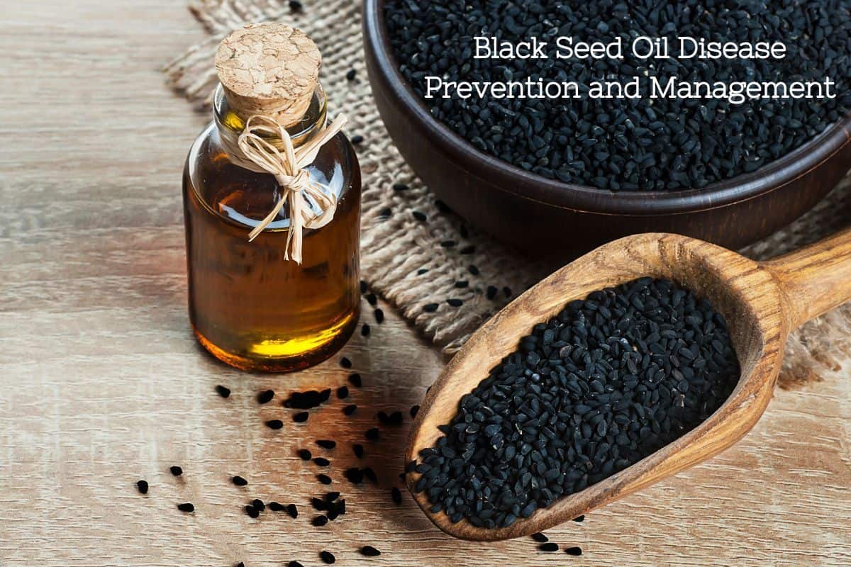 A glass jar of ambler black seed oil with a cork and burlap tie on it next to a wooden scoop and bowl of black seeds next to it.