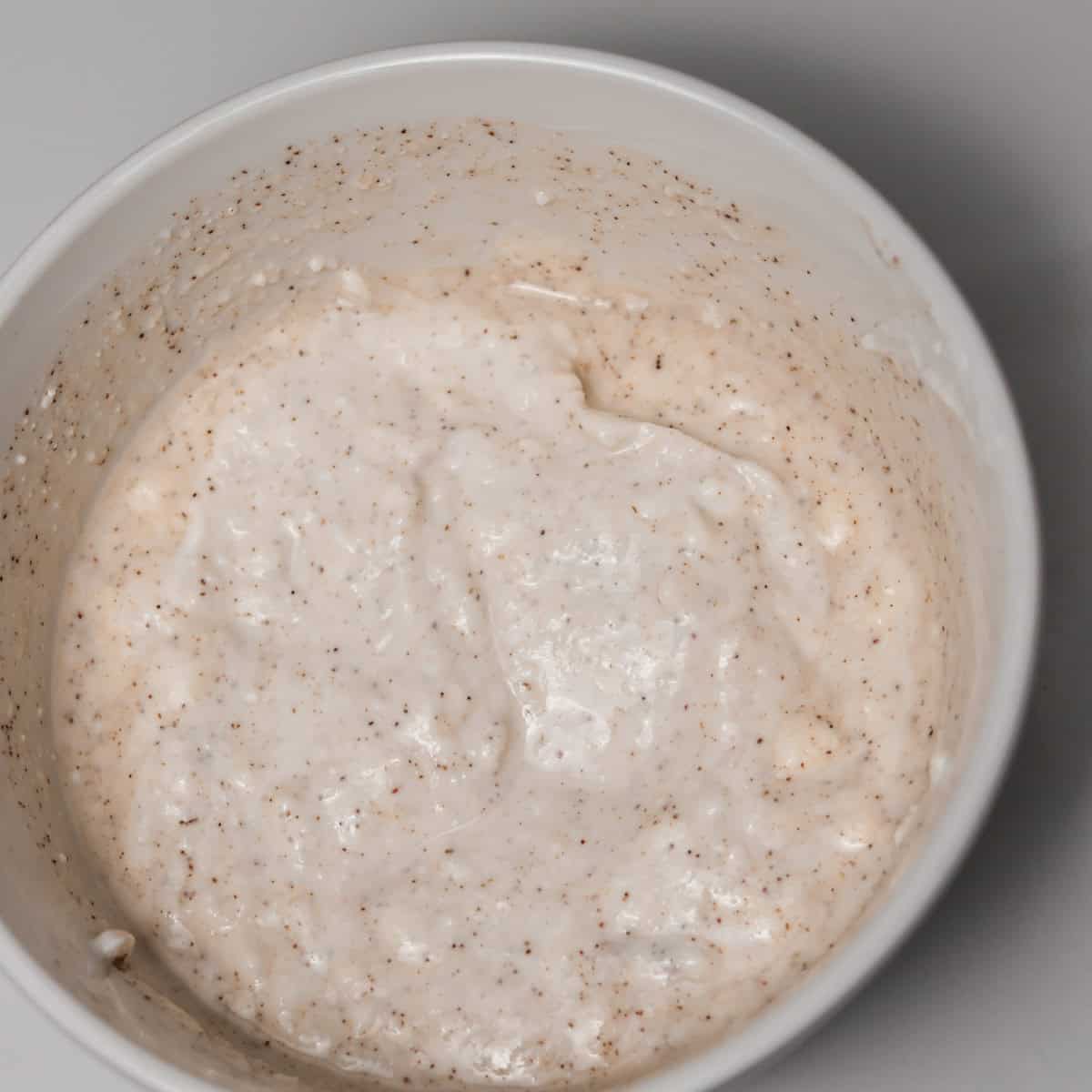 Yogurt mixed with lemon juice, maple syrup, and cayenne pepper into a sweet and spicy sauce.