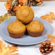 Pumpkin banana muffins displayed on a plate.