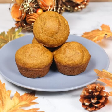 Pumpkin banana muffins displayed on a plate.