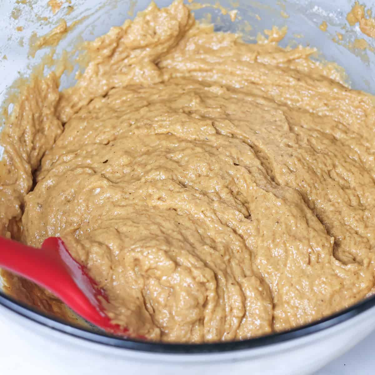 Batter for pumpkin muffins in a bowl.