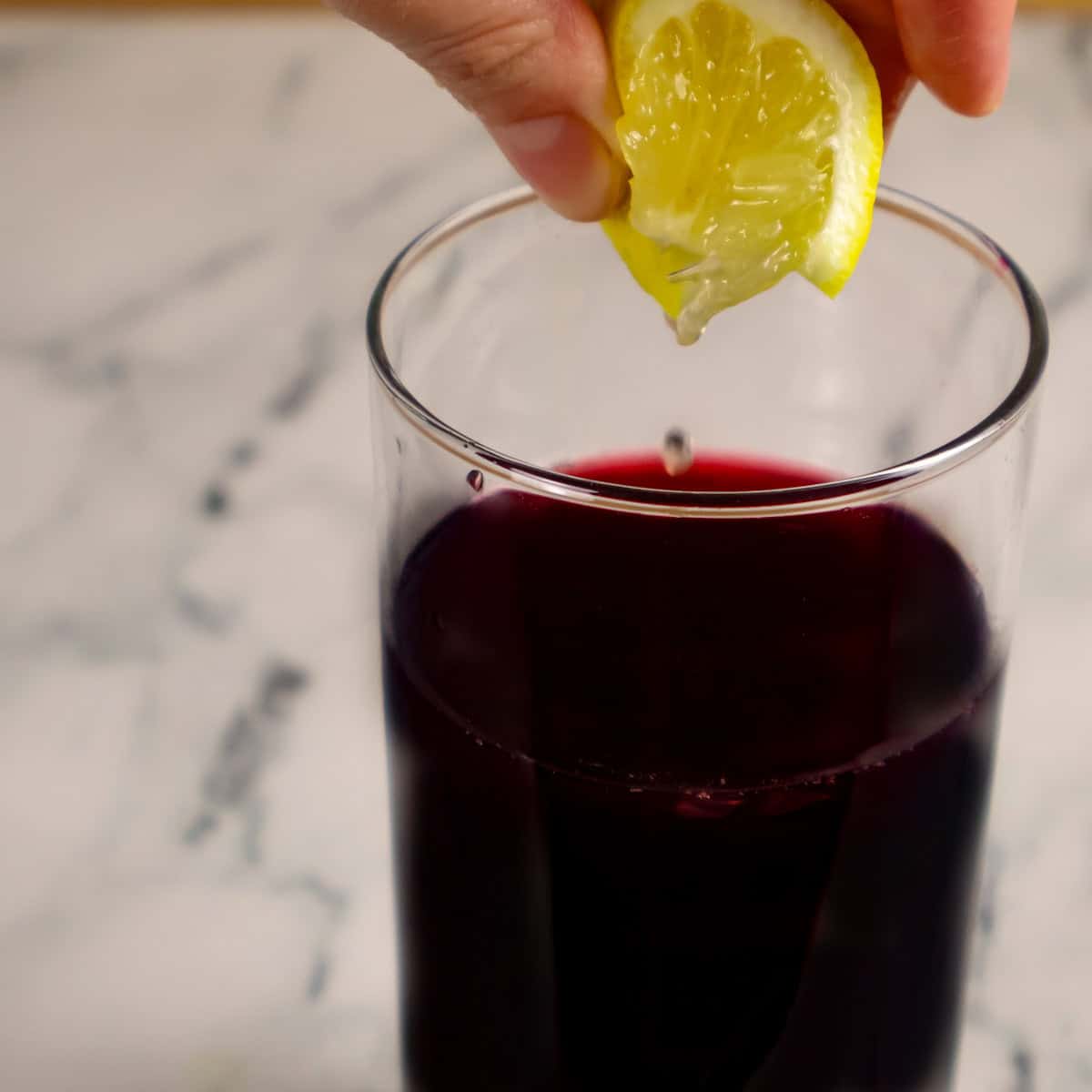 Fresh lemon juice squeezed into an adrenal cocktail.