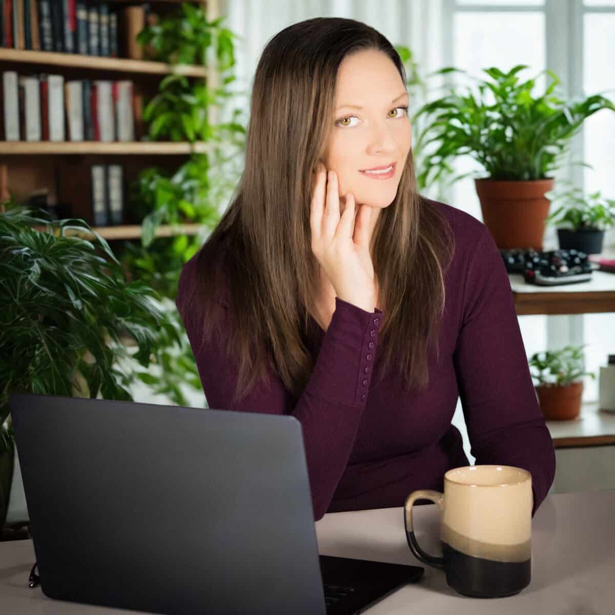 Natalie in the office with more plants.