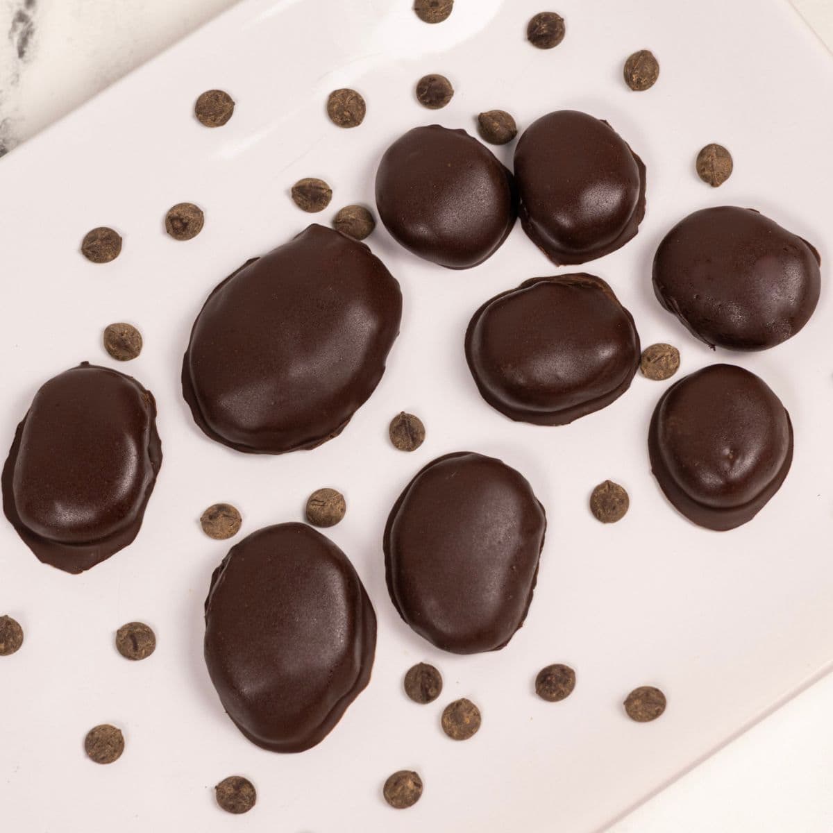 Chocolate covered peanut butter eggs on a serving dish.