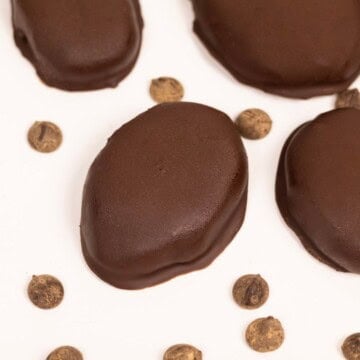 Chocolate covered peanut butter eggs on a serving dish.