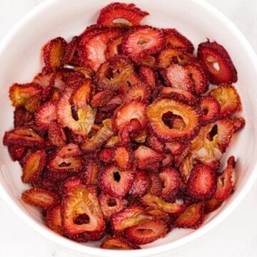 A bowl of dried strawberry slices.